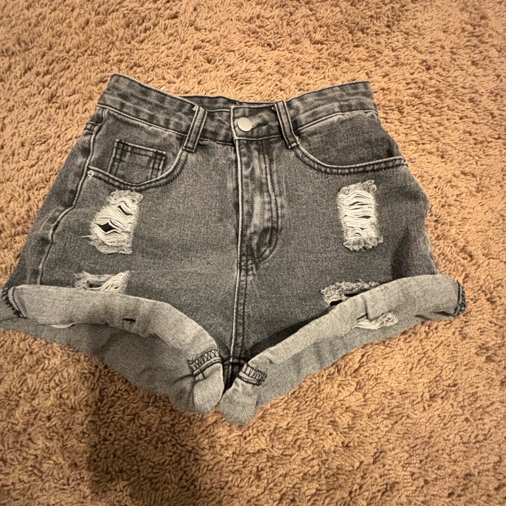 size xsmall black shorts with rips from Shein